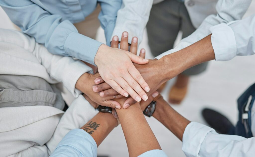 Hands stack, group teamwork and business people celebrate corporate society goals, synergy or agenc